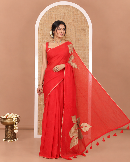 Borderless Red Khadi Mul Cotton Saree, Beautified with Big Hibiscus Floral Motifs Foil-Printed on Its Body, Subtly Sparkled Pallu of the Same Print and Tassels, and Paired with a Matching Blouse