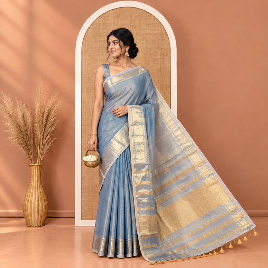 Blue Plain Khadi Tissue Saree, a Gleaming Zari Bavanji Border, Golden Zari Striped Pallu, and Paired with a Matching Blouse