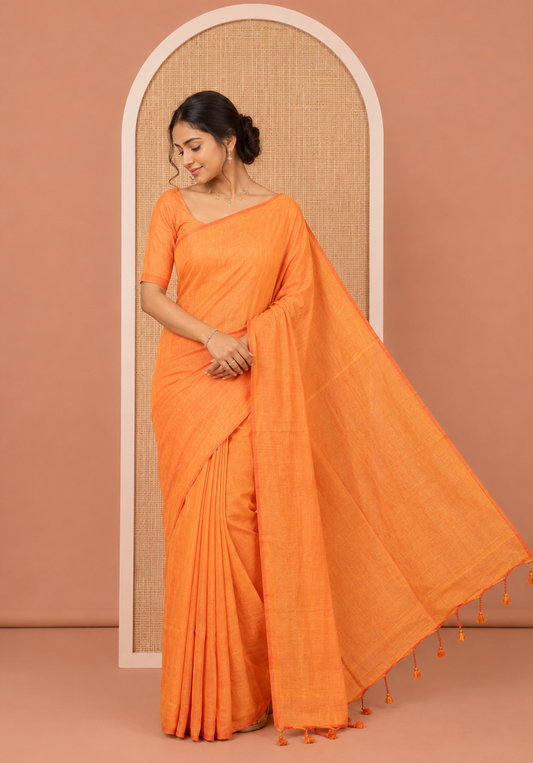 Borderless Orange Plain Khadi Cotton Saree, a Self-Pallu with Tassels, and a Matching Blouse