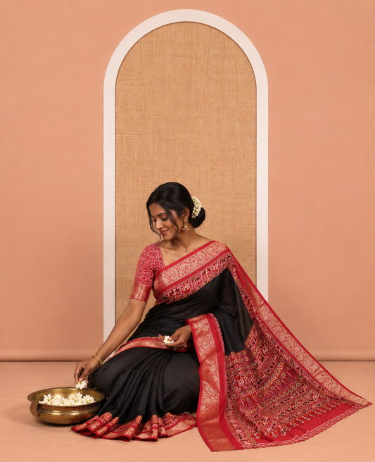 Black Embossed Moss Chiffon Saree, Complemented by a Contrast Traditional Zari Patola Printed Border, Patola Pallu, and a Contrast Blouse