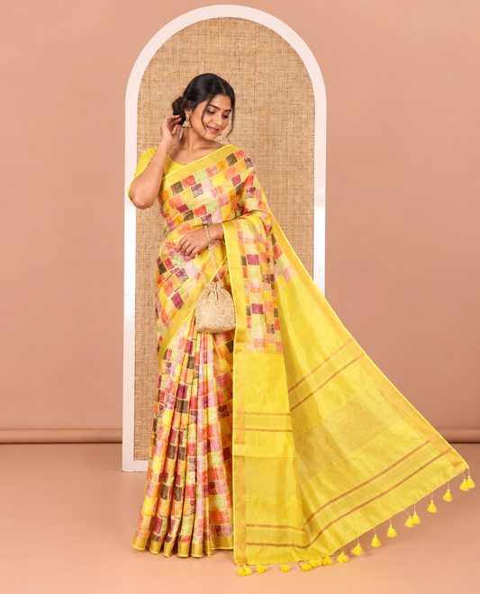 Yellow-base unique motifs enclosed colorful checks printed banana pith saree, zari striped pallu, and a matching blouse