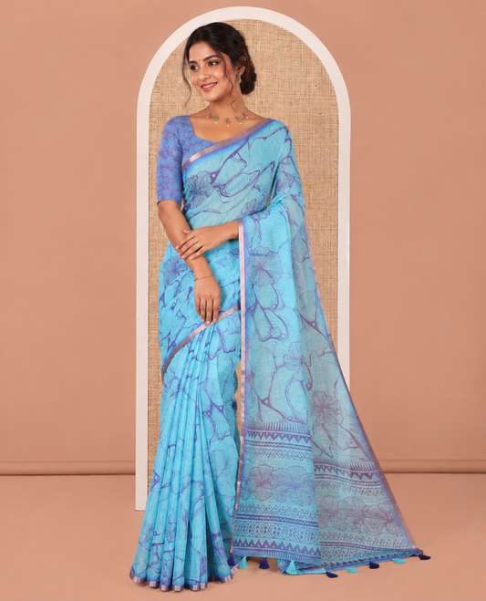 Blue Linen Cotton Saree, Adorned with Abstract Floral Print On Its Body, Subtle Piping Border, Pallu of Floral and Geometric Print, and Paired with a Contrast Blouse