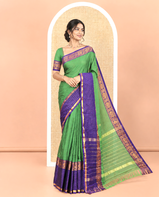 Green Plain Mercerised Cotton Saree, Complemented by Captivating Contrast-Colored Traditional Zari Varisai Pettu Border of Peacock Designs, Subtly Striped Pallu, and Paired with a Matching Blouse