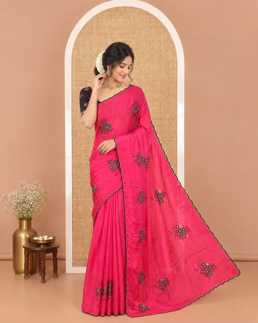 Magenta Rangoli Chiffon Saree, Bedecked with Flower-Style Motifs Embroidered on Its Body, a Subtle Scallop Embroidered Border, a Self-Pallu, and Paired with a Contrast Embroidered Blouse