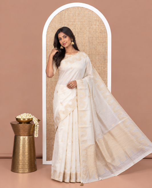 Cream Chanderi Cotton Saree, Adorned with Zari Buttas, Highlighted by Zari Border, Grand Pallu, and a Matching Blouse
