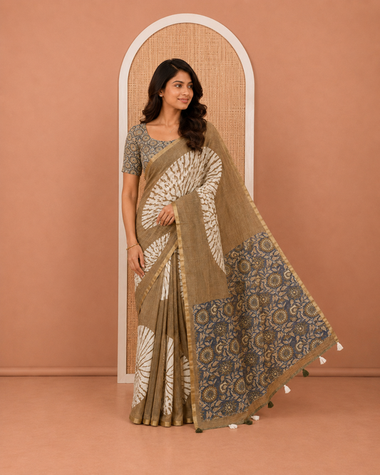 Olive Linen Cotton Saree, Ornamented with Floral Motifs Printed on Its Body, Subtle Piping Border, Complemented by a Contrast Floral Printed Blouse, and Paired with a Contrast Blouse