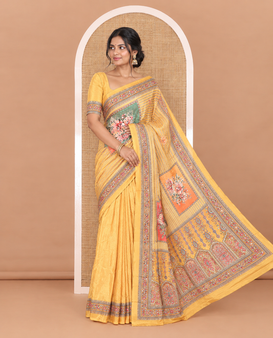 Yellow floral-printed and mirror-work masakali saree, printed with mirror-work border, an intricately decked-up Mughal-style pallu, and a matching blouse