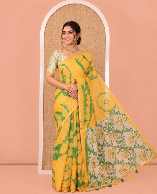 Yellow Linen Cotton Saree, Accentuated with Shibori Printed on Its Body, Subtle Piping Border, Pallu of Floral Vine Print, and Paired with a Contrast Floral Vine Printed Blouse