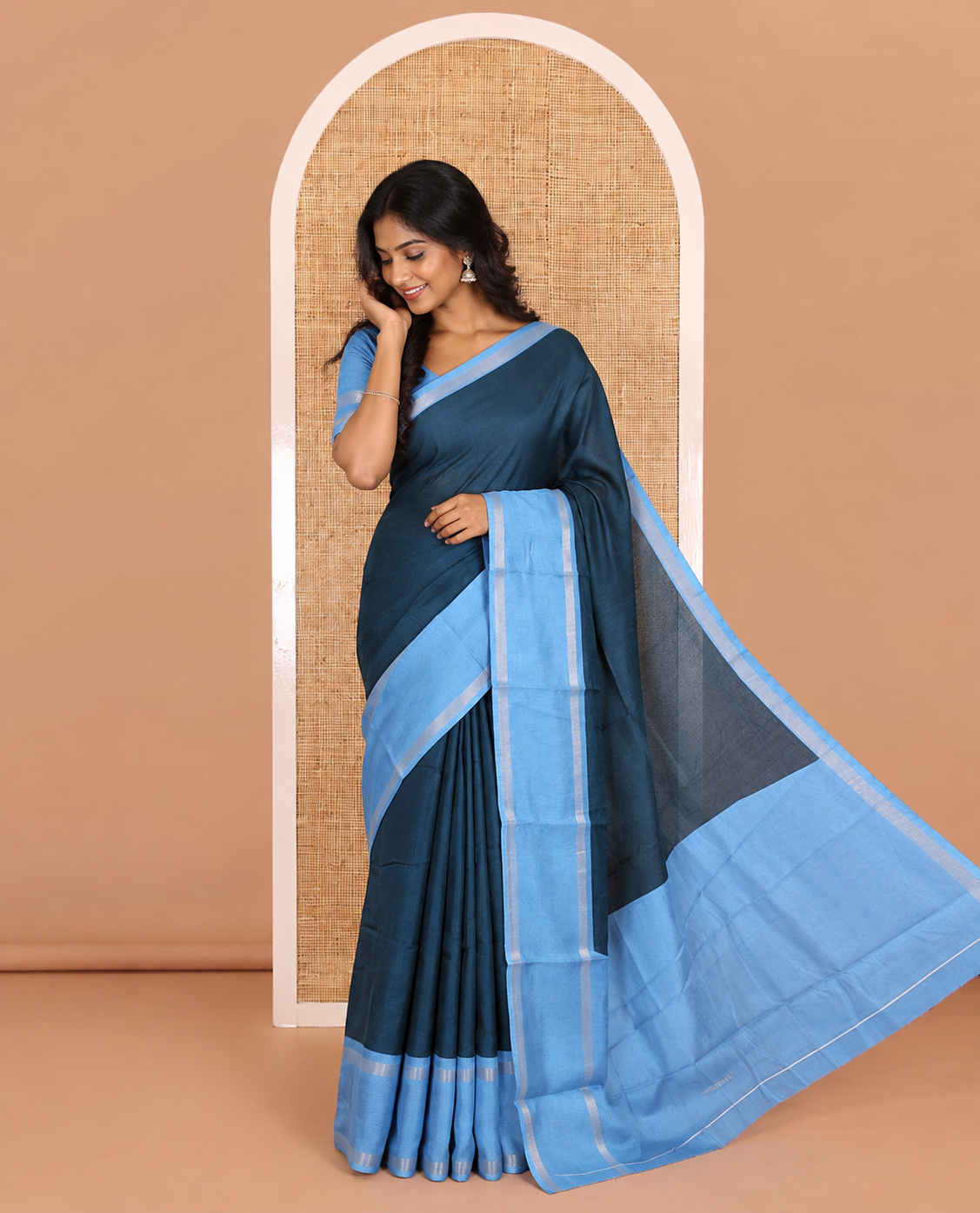 Blue embossed moss chiffon saree, contrast traditional rettai pettu border, embossed pallu, and a contrast embossed blouse