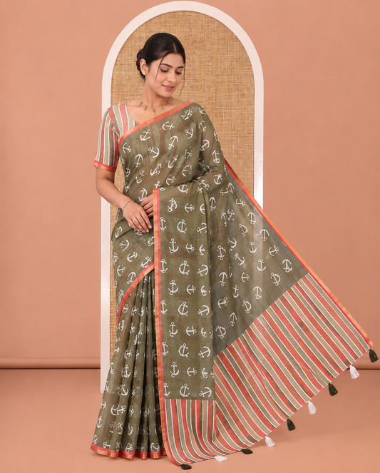 Olive Green Linen Cotton Saree, Steeped with Anchor Motifs Printed on Its Body, a Subtle Contrast Piping Border, Multi-Color Striped Pallu, and Paired with a Contrast Blouse