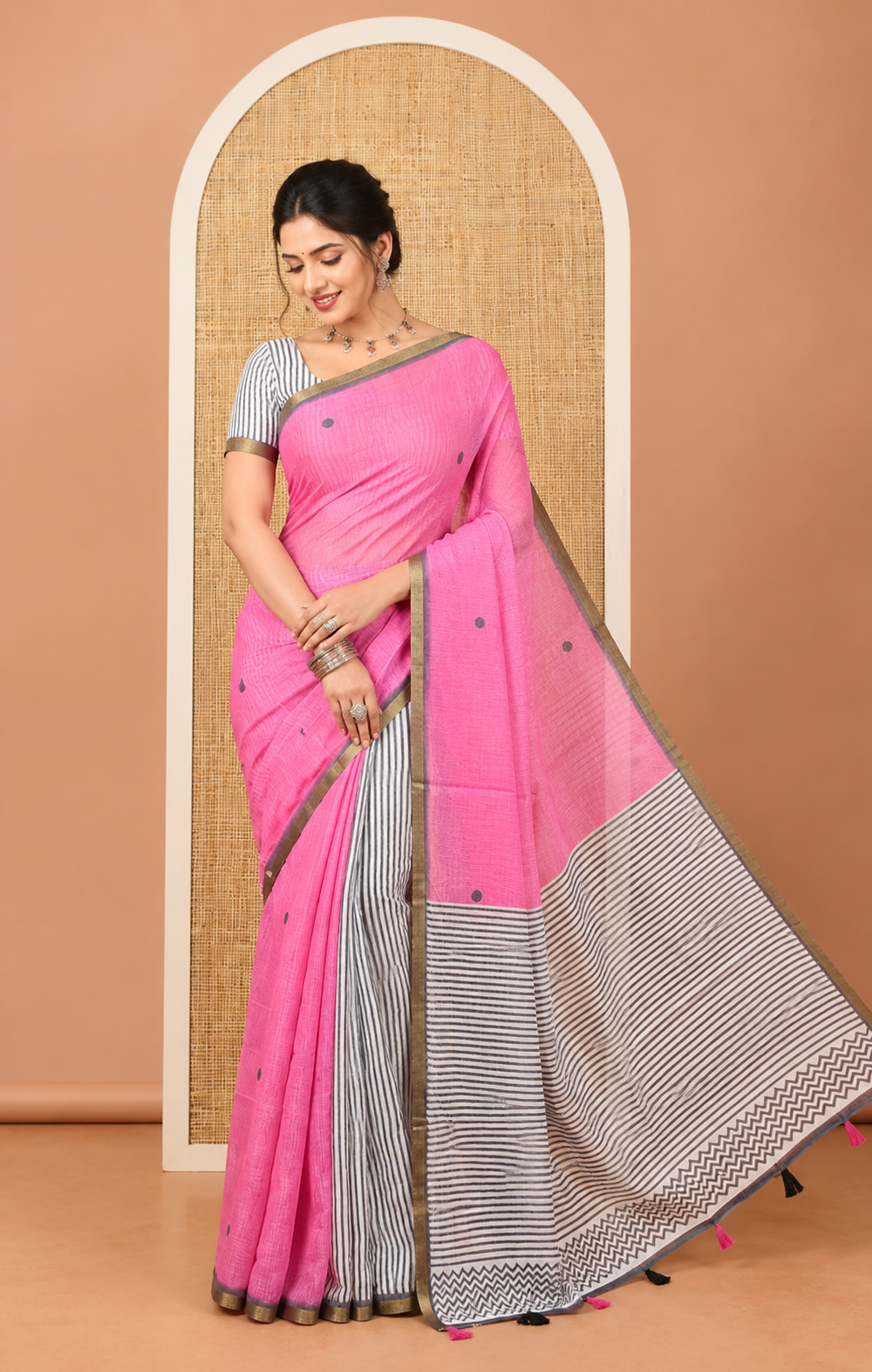 Pink Linen Cotton Saree, Adorned with Half-And-Half-Style Polka Dots, a Subtle Piping Border, Contrast Vertically Striped Pallu, and a Contrast Blouse
