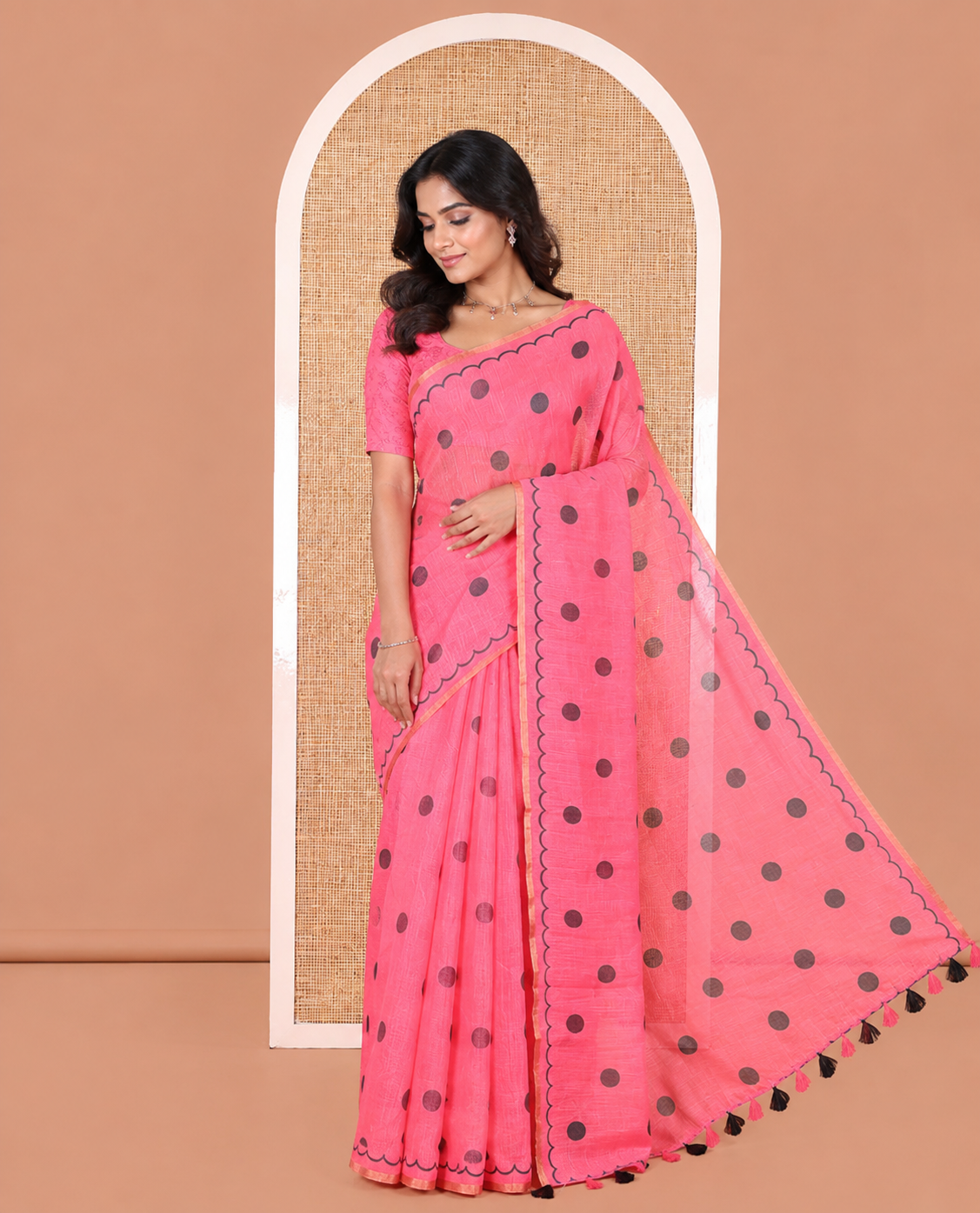 Pink Linen Cotton Saree, Beautified with Polka Dots All Over Its Body, Subtle Piping Border, Self-Pallu, and Paired with a Floral Printed Matching Blouse