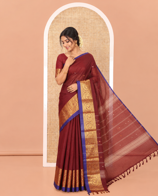 Maroon Chettinad Cotton Saree, Elevated with Thread Buttas All Over Its Body, Highlighted by Traditional Zari Border of Round Peacock Designs, Subtly Striped Pallu, and Paired with a Matching Blouse