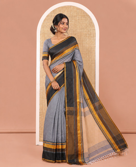 Grey-Block Plain Khadi Mul Cotton Saree, Complemented by a Contrast Thread-Woven Border of Geometric Patterns, Contrast Plain Pallu, and Paired with a Matching Blouse
