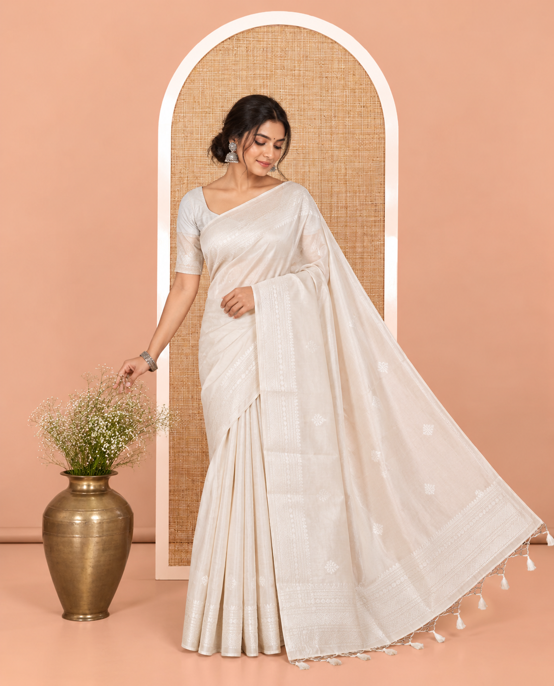 Off-white Elite Soft Silk Saree, Subtly Sparkled with Ogee Jacquard Design, a Traditional Zari Border, Zari Pallu, and a Matching Blouse