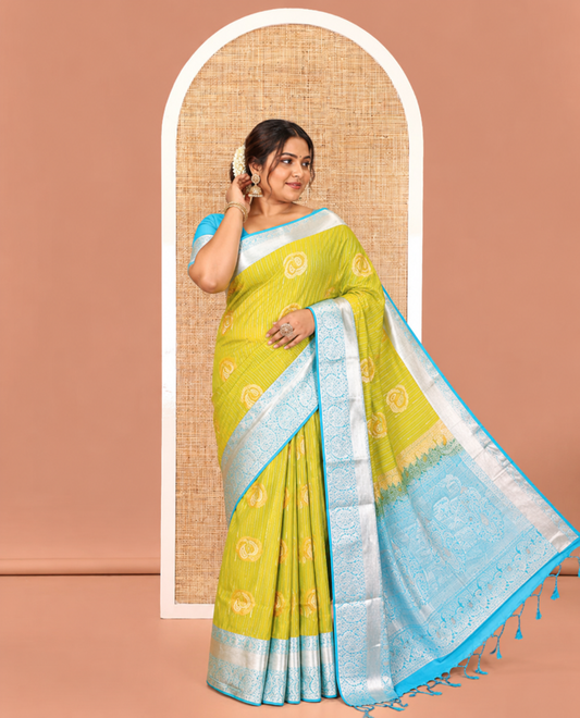 Parrot Green Semi-Soft Silk Saree, Elegantly Crafted with Vaira Oosi, and Paisley Buttas All Over Its Body, Complemented by Contrast Traditional Border of Paisleys, Intricately Designed Pallu, and Paired with a Contrast Blouse