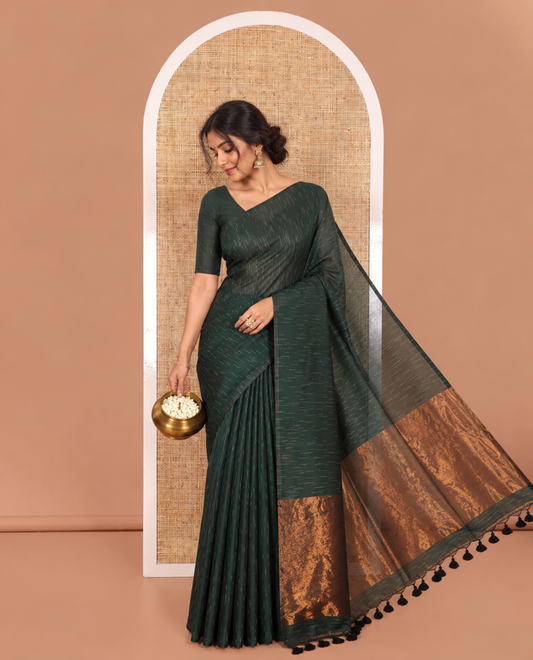 Borderless Green Khadi Mul Cotton Saree Decked with Jharna-Style Waterdrop Motifs, Featuring a Gleaming Zari-Woven Pallu, Paired with a Matching Blouse Replicating the Body Motifs