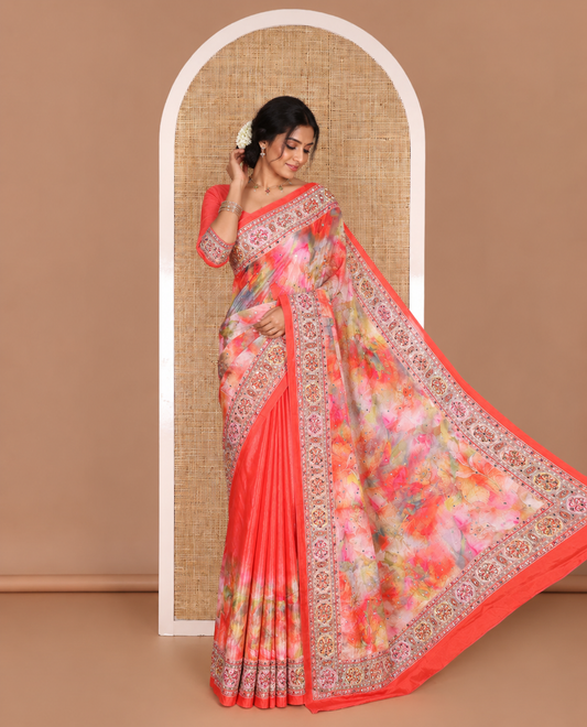 Red-base kaleidoscopic colored floral printed with mirrorwork masakali saree, printed with mirrorwork border and pallu, along with a matching printed blouse