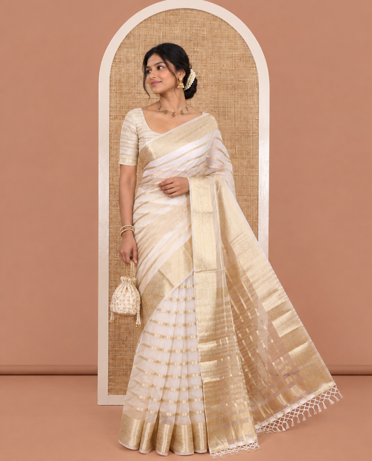 Cream Semi-Organza Saree, Boldly Accentuated with Zari Stripes, Highlighted by a Zari Traditional Border, and a Matching Blouse