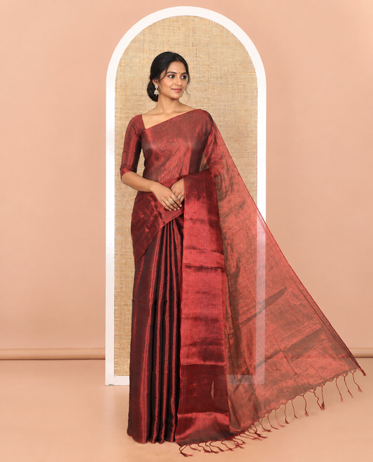 Borderless maroon plain khadi tissue saree self pallu with tassels and a matching blouse