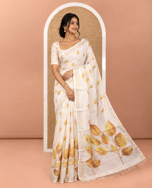 Cream Tissue Saree, Adorned with Dried Leaf Motifs Printed All Over Its Body, Subtle Bavanji Border, Pallu Features a Leaf Print, and Paired with a Matching Dried Leaf Printed Blouse