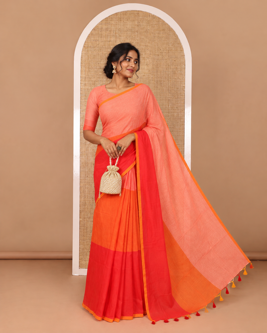 Borderless orange tri-ombre-colored plain khadi mul cotton saree with self-pallu, multi-colored tassels and a matching blouse