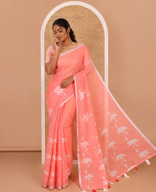 Orange Pichwai lotus printed linen cotton saree, piping zari border, colorful tasselled lotus printed pallu, and a contrast lotus printed blouse