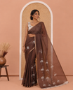 Brown Linen Cotton Saree, Accentuated with Pichwai Lotus Motifs Print, Subtle Piping Border, Pallu Mirrors the Same Pichwai Lotus Print, and Paired with a Contrast Pichwai Lotus Printed Blouse