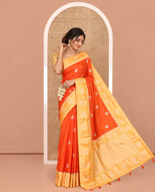 Orange Fancy Raw Silk Saree, Detailed with Floral Zari Buttas, a Contrast Floral Temple Border, Intricate Pallu, and a Contrast Blouse
