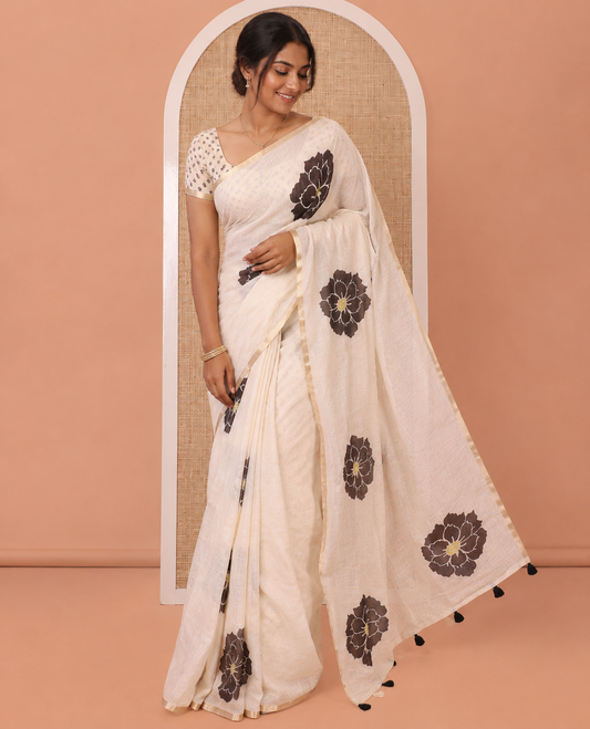 Peach Linen Cotton Saree, Beautified with Flower Motifs Printed on Its Body, Subtle Piping Border, Self-Printed Pallu, and Paired with a Matching Blouse