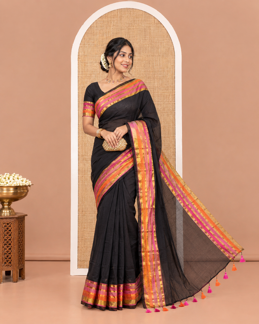 Black Plain Khadi Mul Cotton Saree, Complemented by Contrast Pink-Orange Zari Striped Border, Self-Pallu, and Paired with a Matching Blouse