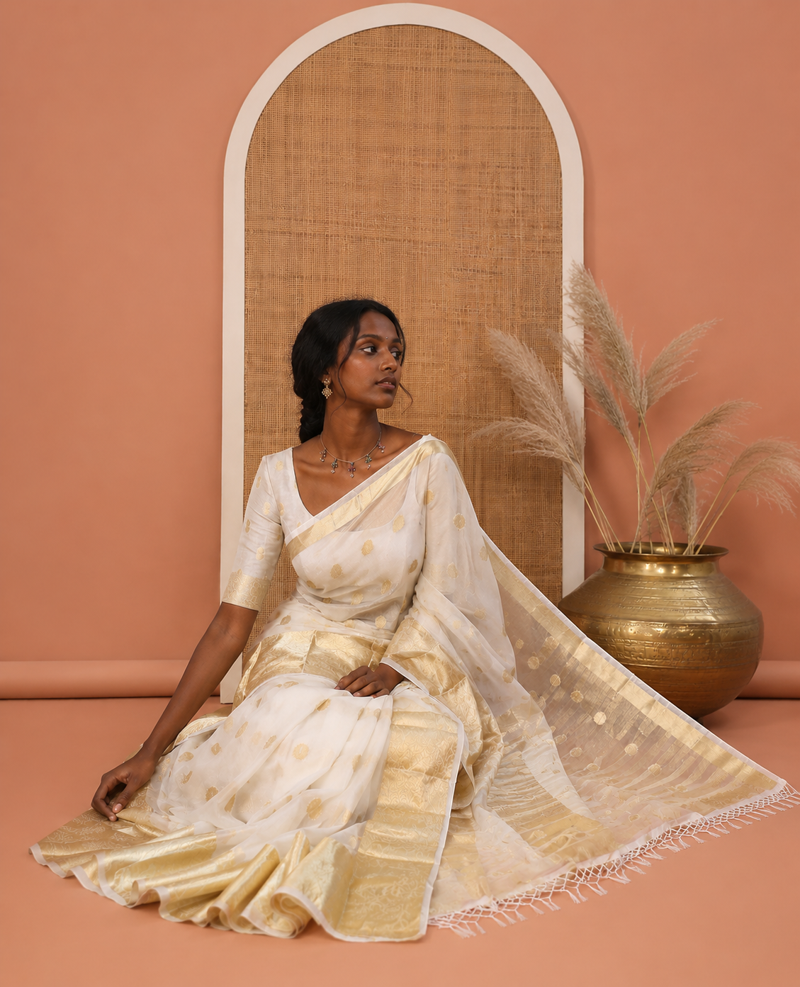 Cream Semi-Organza Saree, Charmingly Accented with Zari Buttas, Highlighted by a Zari Floral Creeper Border, and a Matching Blouse