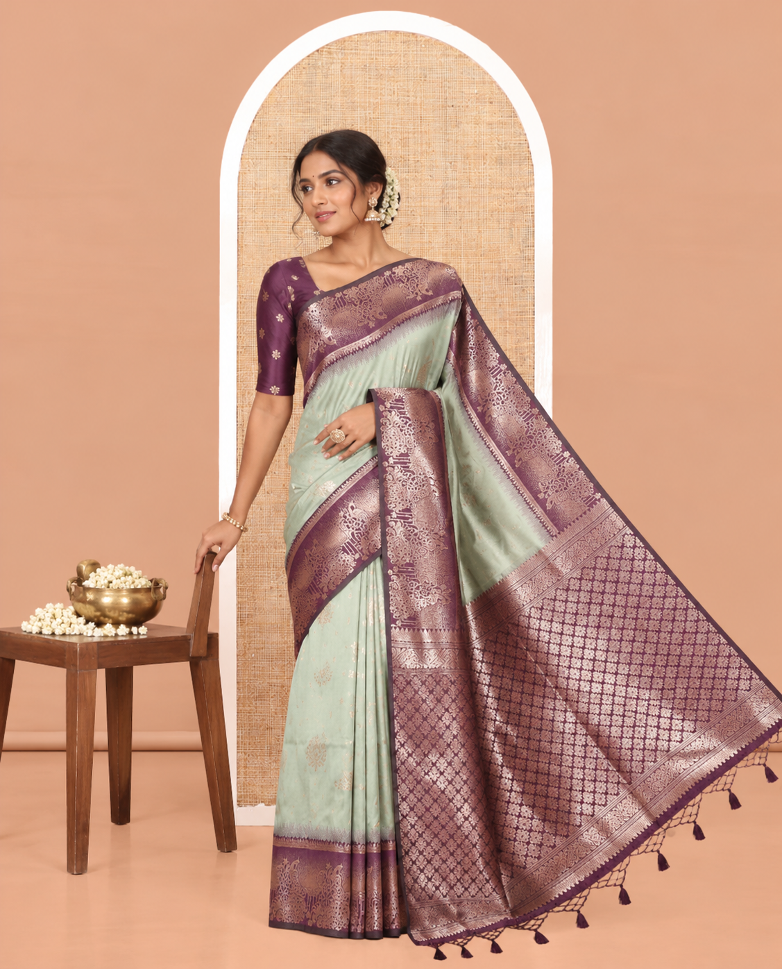 Pista Green Elite Soft Silk Saree, Featuring Zari Buttas on Its Body, Complemented by a Contrast Peacock-Floral Zari Blouse, Intricately Designed Pallu, and Paired with a Contrast Blouse