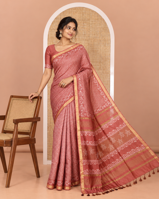 Rust diamond patterns batik printed banana pith saree, printed piping border, printed pallu, and a matching blouse