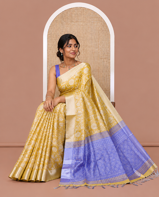 Yellow Tissue Cotton Saree Features Floral Vine Design, a Zari Border, Contrast Intricate Pallu, and a Contrast Blouse