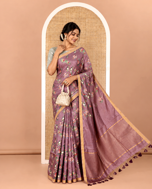Grape-color colorful floral bunches printed banana pith saree, piping zari border, striped pallu, and a printed blouse
