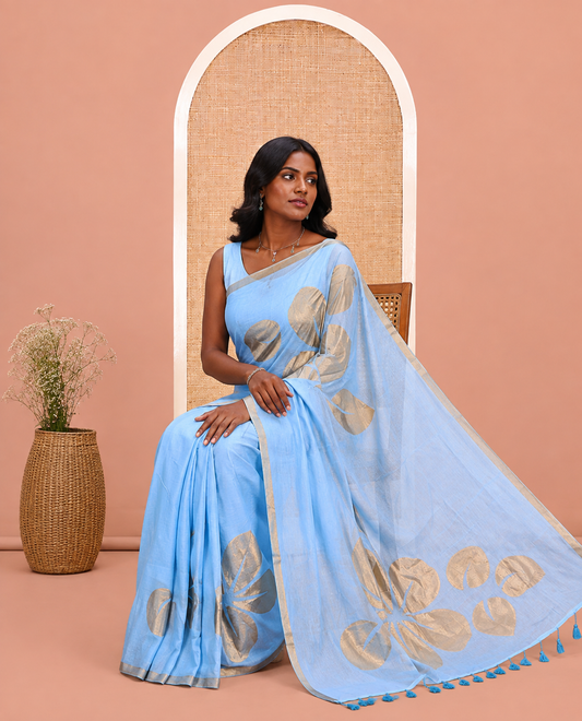 Blue Khadi Mul Cotton Saree Features Floral Motifs Glitter-Print, a Piping Border, and a Matching Blouse