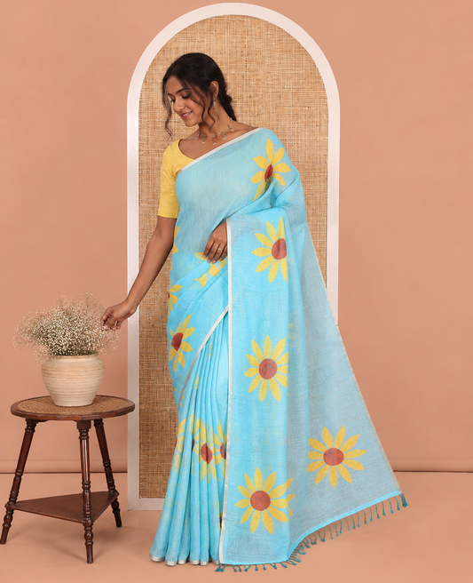 Sky Blue Linen Cotton Saree, Impeccably Styled with Sunflower Motifs Print, a Piping Border, and a Contrast Blouse