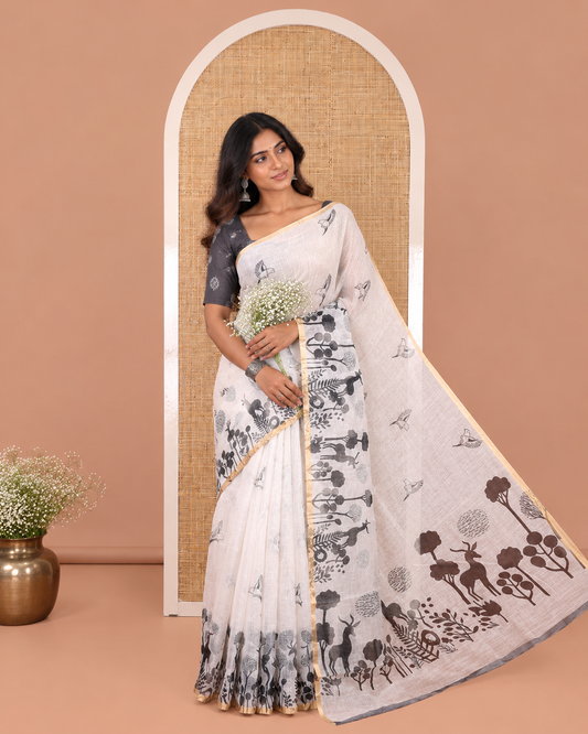 White Linen Cotton Saree, Accentuated with Flora-Fauna Print, a Piping Border, Printed Pallu and a Contrast Blouse