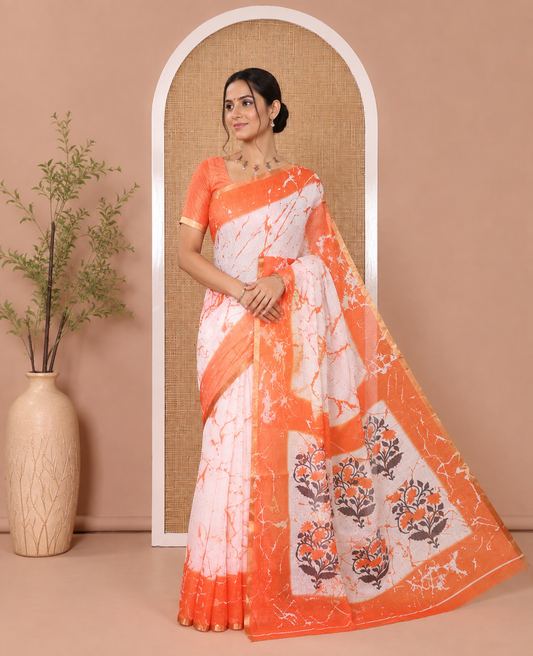 Cream and Orange Linen Cotton Saree, Adorned with Batik Print on Its Body, Complemented by Contrast Batik Printed Border, Pallu of Floral Print, and Paired with a Contrast Blouse