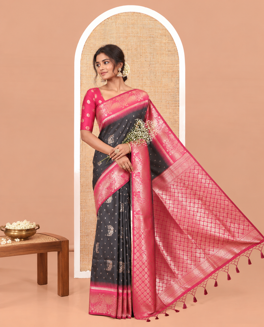 Black Elite Soft Silk Saree, Woven with Zari Buttas on Its Body, Complemented by a Contrast Peacock-Floral Zari Blouse, Intricately Designed Pallu, and Paired with a Contrast Blouse