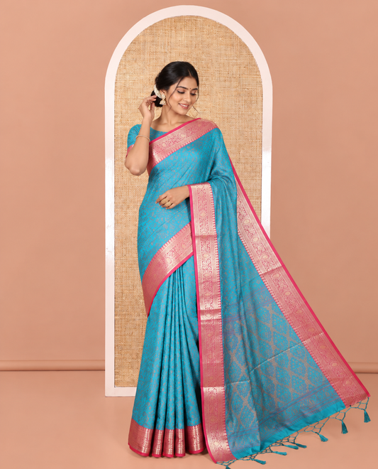 Rama Elite Soft Silk Saree, Subtly Sparkled with Floral-Paisley Designs On Its Body, Complemented by Contrast Traditional Zari Designs Woven Border, Intricately Designed Pallu, and Paired with a Matching Blouse