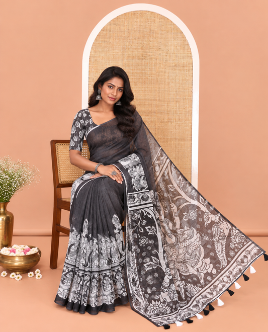 Black Linen Cotton Saree, Artfully Detailed with Kalamkari Human Figurines Printed On Its Body, Highlighted by Self-Pallu Pictures Human Figurines, and Paired with a Printed Blouse