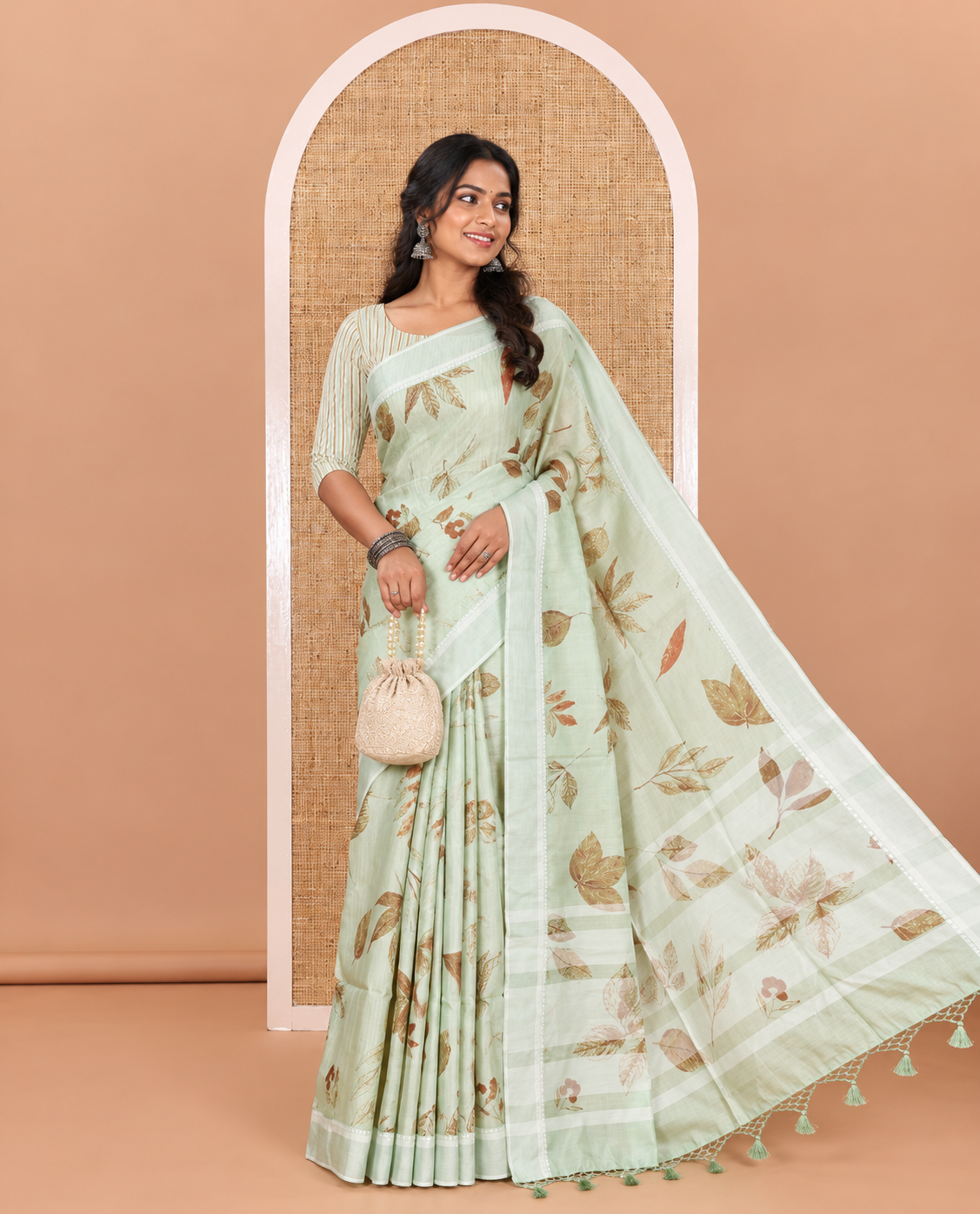 Pista green unique size and shaped leaf motifs printed fancy tussar saree, resham thread woven border, leaf motifs printed pallu, and a matching striped blouse