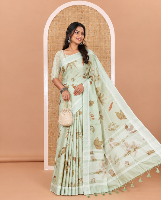 Pista green unique size and shaped leaf motifs printed fancy tussar saree, resham thread woven border, leaf motifs printed pallu, and a matching striped blouse
