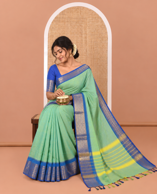 Blue-Green Double-Shade Plain Chettinad Cotton Saree, Complemented by Contrast Border Steeped with Traditional Zari Designs, Subtly Striped Pallu, and Paired with a Matching Blouse