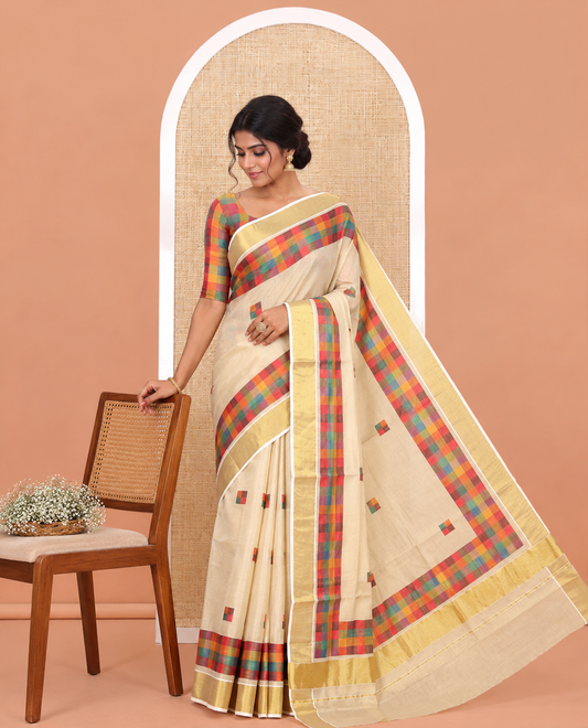 Gold-Purple Kerala Tissue Cotton Saree Features Madras Checked Buttas, a Zari Checked Border, and a Contrast Blouse