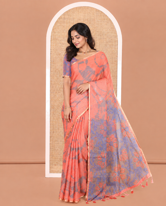 Orange Linen Cotton Saree, Adorned with Shibori Printed on Its Body, Subtle Piping Border, Pallu Features Floral Print, and Paired with a Contrast Floral Printed Blouse