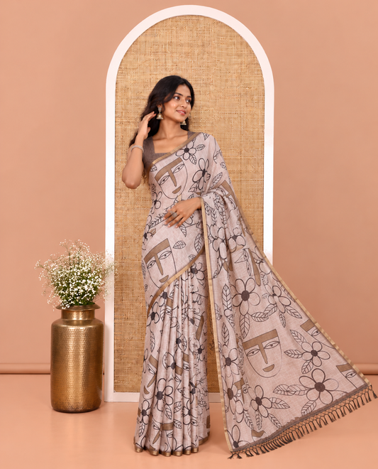Green Linen Cotton Saree, Showcasing Flowers and Faces Printed on Its Body, Subtle Zari Piping Border, Pallu Mirrors the Self-Print, and Comes with a Contrast Blouse