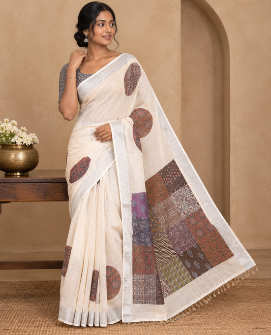 Cream Linen Cotton Saree Features Ajrakh Geometric Print, a Zari Border, Printed Pallu, Contrast Blouse